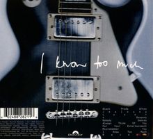 Der Text lautet: "I know too much." Es zeigt eine Nahaufnahme einer E-Gitarre. Am unteren Rand ist ein Barcode.
