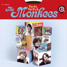 "The A's, The B's & The Monkees". Eine Anordnung von Album-Covern in Form von bunten Würfeln, darunter Porträts der Bandmitglieder.