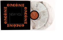 "ORGŌNE New You" in orange und weißem Text auf schwarzem Hintergrund; zwei marmorierte Vinyl-Schallplatten sichtbar.