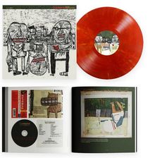 Cover-Text: "Quicksand". Eine rote Vinyl-Schallplatte und ein geöffnetes CD-Booklet mit abstrakten Zeichnungen.