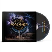 "Foreigner In the Eye of the Storm Celebrating 1976-2026 Fifty Years" auf dunklem Stadtbild mit Sturmwolken.