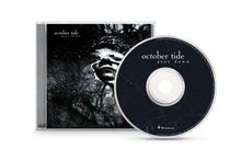 CD mit Text "october tide grey dawn". Cover zeigt Gesicht in düsterer Atmosphäre mit Rissen und Schatten.