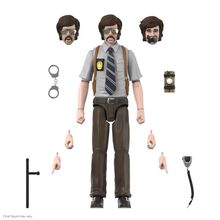 Polizeifigur mit Wechselköpfen und -händen, Handschellen, Funkgerät, Taschenlampe.