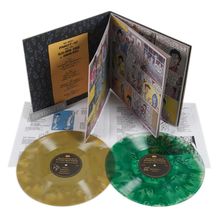 "The Great Parrot" auf Gold-Karte. Comic-Illustration daneben. Zwei bunte Schallplatten, gelb und grün, mit Texten.