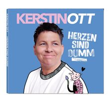 Auf blauem Hintergrund "Kerstin Ott" und "Herzen sind dumm". Person lächelt, daneben eine gezeichnete Katze.