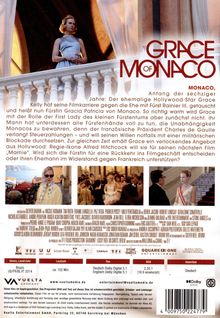 „GRACE OF MONACO“ steht oben rechts. Eine elegante Frau in einem blauen Kleid steht auf einem Balkon mit weißen Balustern.