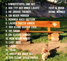 Trackliste und Hinweis auf Bernd Wörner. Eine hölzerne Bank steht im Gras, ein kleiner Hund läuft im Vordergrund.