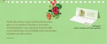 Text: "Für die, die mit ihren Augen und ihrem Herzen sehen..." Rechts ist ein Kalender, links oben Blumen.