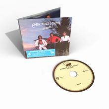 CD und Cover von "Emerson, Lake & Palmer - Love Beach". Drei Männer stehen in tropischer Umgebung.