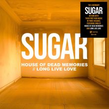 Text: "SUGAR", "HOUSE OF DEAD MEMORIES // LONG LIVE LOVE". Ein leerer Raum in orange-bräunlichem Licht.