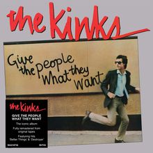 Albumcover "the Kinks". Graffiti: "Give the people what they want". Mann in Anzug läuft rechts.