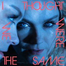 Text: "I THOUGHT WE WERE THE SAME". Zwei Gesichter mit intensiven blauen Augen, nah beieinander.
