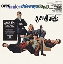 Die Texte sagen: "over under sideways down," daneben steht "The Yardbirds." Fünf Männer in stilvoller Kleidung posieren lässig.