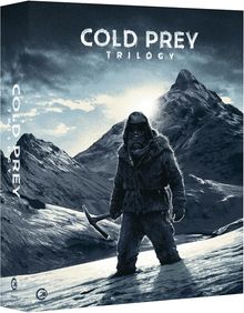 Text: „COLD PREY TRILOGY“. Illustration: Eine Person in Winterkleidung auf einem verschneiten Berg mit einer Spitzhacke.