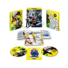 "Blu-ray My Hero Academia 1. Staffel" mit gelben Hüllen, Figuren, zwei Discs und einem Booklet mit Heldenmotiven.