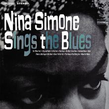 "Nina Simone Sings the Blues." Titel, Liedtexte unten. Schwarz-Weiß-Foto eines Gesichts mit hervorgehobenen Augen.