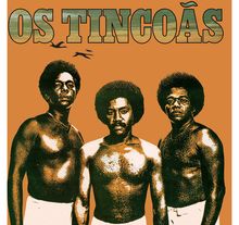 „OS TINCOÃS“ steht oben. Drei Männer mit Afrofrisuren, oberkörperfrei, im Vintage-Stil dargestellt.