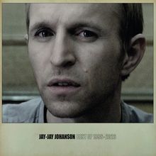 Text: "JAY-JAY JOHANSON BEST OF 1996-2026". Gesicht eines nachdenklichen Mannes im Vordergrund.
