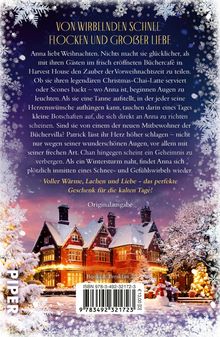 "Von wirbelnden Schneeflocken und großer Liebe" steht oben in goldener Schrift. Winterliche Szenerie mit Haus.