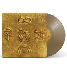 Goldene Platte mit strukturiertem Cover: Symbolen wie Unendlichkeit, "W" mit Händen, Schlange, Werkzeug und Regenbogen.