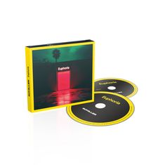 Text: "Euphoria", "SCHILLER", "Disc 1", "Disc 2". Gelbe CD-Hülle mit rotem Licht. Zwei schwarze CDs mit gelbem Rand.
