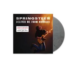 "SPRINGSTEEN DELIVER ME FROM NOWHERE" steht oben. Darunter ein Gitarrist in der Luft mit einem gelben Scheinwerfer.