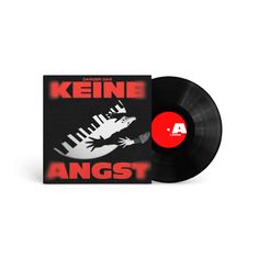 Rote Schrift: "DANGER DAN", "KEINE ANGST". Schallplatte mit rotem Label. Illustration: Klaviertasten und Hände.
