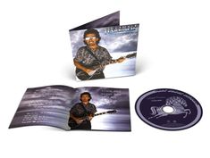 Auf der CD und dem Cover steht "George Harrison Cloud Nine". Ein Bild zeigt einen Mann mit Gitarre vor wolkigem Hintergrund.