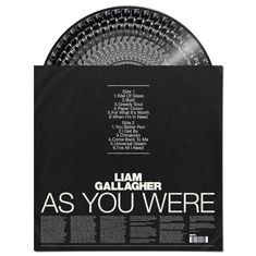 Schwarze Hülle mit weißem Text: Albumtitel "AS YOU WERE", Künstler "LIAM GALLAGHER", Trackliste für beide Seiten. Vinyl teilweise sichtbar.