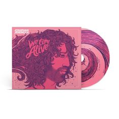 Text: "Jonathan Jeremiah We Come Alive". Illustration eines Mannes mit langem Haar und Bart in Pink- und Violetttönen.