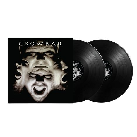 "CROWBAR" steht oben. Ein surreal verschlungenes Gesicht und zwei schwarze Schallplatten.