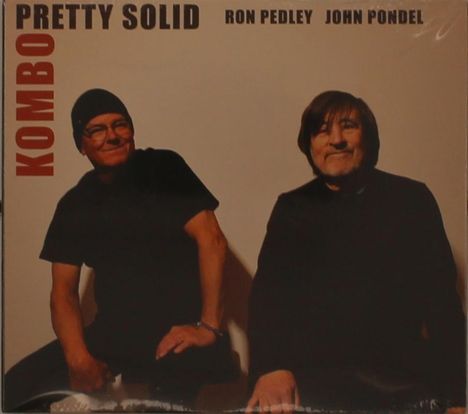 KOMBO, PRETTY SOLID, RON PEDLEY, JOHN PONDEL. Zwei Männer in dunkler Kleidung sitzen und lächeln freundlich.