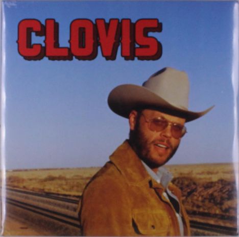 "Clovis" in roten Buchstaben. Ein Mann mit Cowboyhut und Sonnenbrille steht in einer weiten Landschaft.
