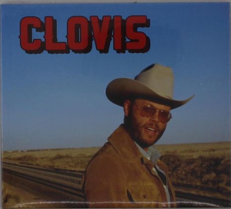 Text "CLOVIS" in großen roten Buchstaben oben. Ein Mann mit Cowboyhut und Sonnenbrille steht vor einer weiten Prärie.