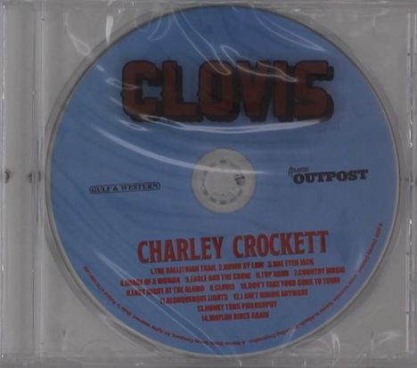 CD mit Text: "CLOVIS", "GULF & WESTERN", "ALAMO OUTPOST", "CHARLEY CROCKETT", und 14 Liedtitel darunter auf blauem Hintergrund.