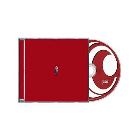 Der Text "Pfiff" steht auf einer CD mit rotem Cover, das eine winzige Person zeigt.