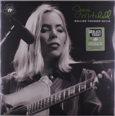 Text: "Joni Mitchell", "Rolling Thunder Revue", "RSD Black Friday", "Celebrating 50 Years". Frau spielt Gitarre vor Mikrofon.