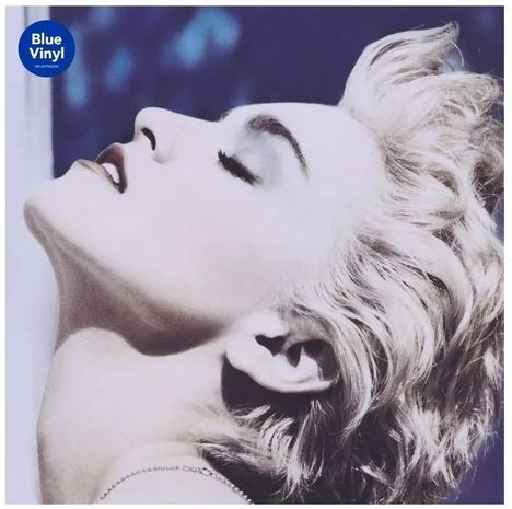Text: "Blue Vinyl." Eine stilisierte Person mit blondem Haar und geschlossenen Augen in Seitenansicht.