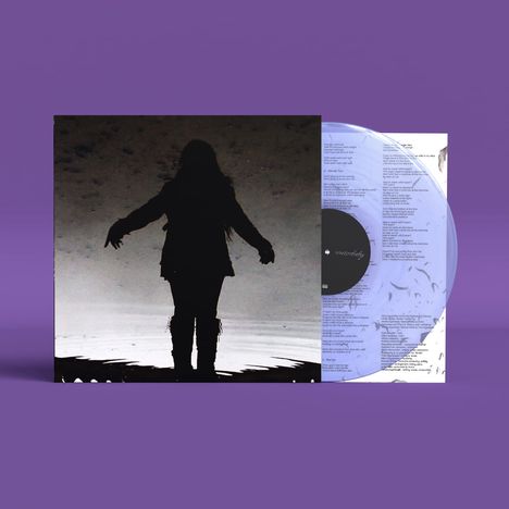 Ein Vinyl-Cover mit dem Text „underneath“ und das Bild einer Person als Silhouette vor einem grauen Hintergrund.