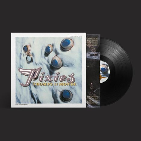 Text: Pixies, Trompe le Monde. Schwarze Vinyl-Schallplatte mit auffälligem Coverdesign aus Augen auf heller Oberfläche.