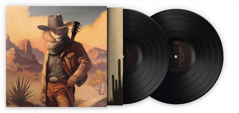 "Carin Leon, Colmillo de Leche". Illustration: Löwe als Cowboy mit Gitarre in Wüstenlandschaft, zwei Schallplatten.