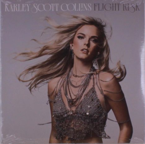 Der Text "Karley Scott Collins Flight Risk" steht oben. Eine Frau mit langen Haaren trägt ein funkelndes Oberteil.
