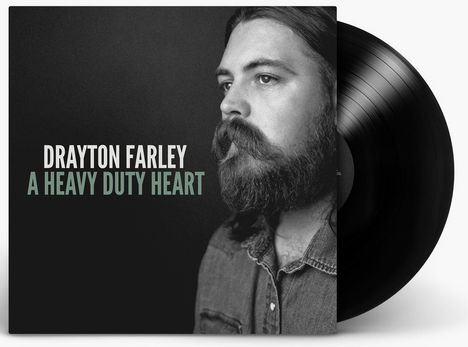 „DRAYTON FARLEY A HEAVY DUTY HEART“ steht über einem schwarz-weißen Porträt eines bärtigen Mannes mit ernstem Blick.