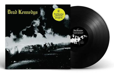 „Dead Kennedys“ in gelber Schrift. Schwarz-weißes Cover zeigt brennendes Auto. Eine Vinyl-Schallplatte daneben.