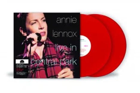 Text: "annie lennox live in central park." Rotes Doppel-Vinylalbum, Sängerin mit Mikrofon in der Hand.