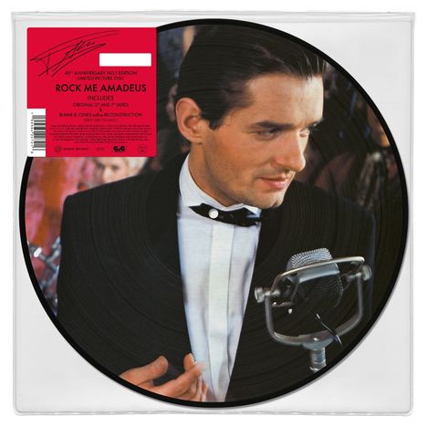 "Rock Me Amadeus, 40th Anniversary No.1 Edition, Limited Picture Disc. Ein Mann im Anzug mit Mikrofon."