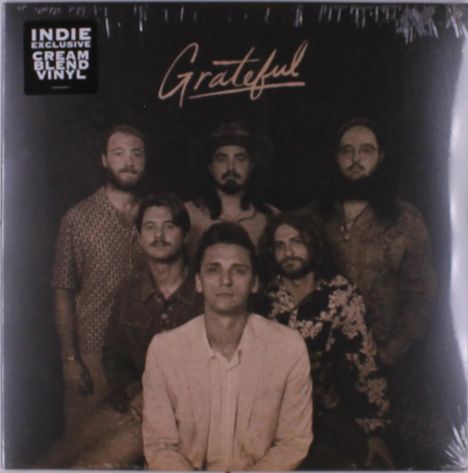 „INDIE EXCLUSIVE CREAM BLEND VINYL“ und „Grateful“; sechs Männer in dunkler, stilisierter Kleidung.