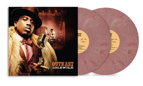 Aufschrift "OUTKAST IDLEWILD". Ein Mann in Fellmantel und Hut hält ein Mikrofon. Zwei rot marmorierte Schallplatten.
