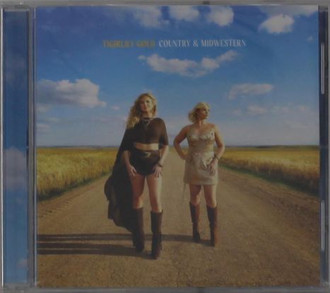 Oben steht: "Tigirlily Gold Country & Midwestern". Zwei Frauen in Country-Outfits stehen auf einem Feldweg.