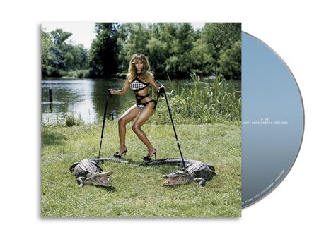 Der Text "B'Day (20th Anniversary Edition)" steht auf einer CD. Eine Frau in Schwarz-Weiß-Bikini posiert mit zwei Alligatoren.